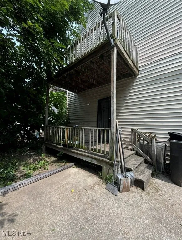 Property entrance with a wooden deck
