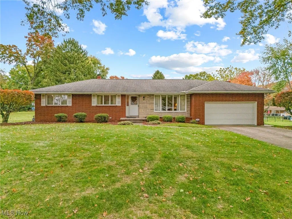 Well maintained brick & stone ranch, two car garage, beautiful lot