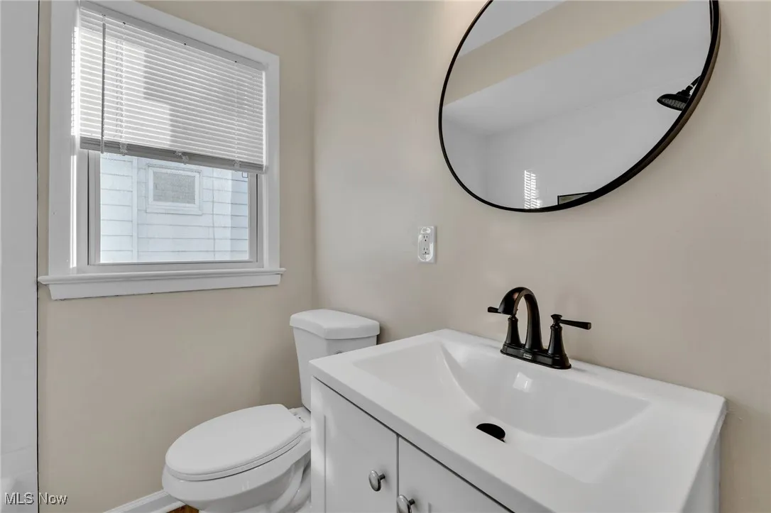 Bathroom with vanity and toilet
