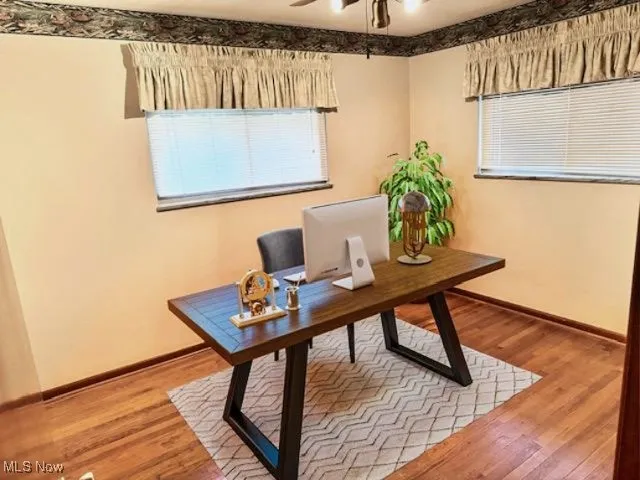 Home office featuring ceiling fan and light wood finished floors