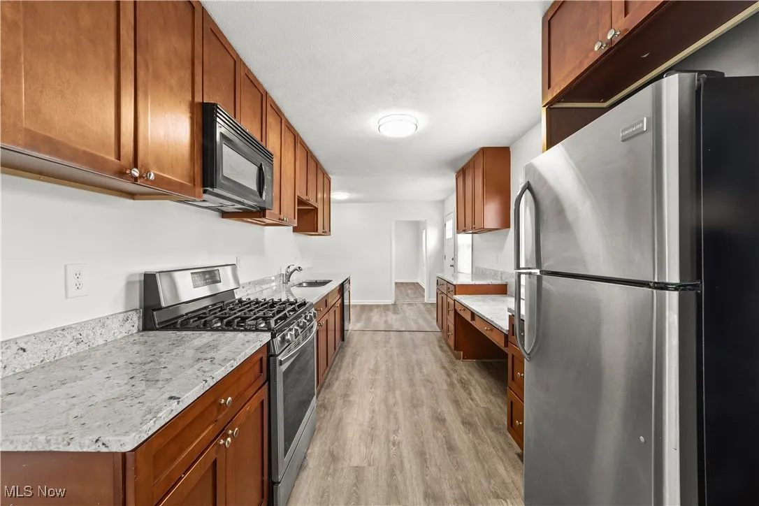 Fantastic Kitchen with Granite Counters, Maple Cabinets & Stainless Appliances