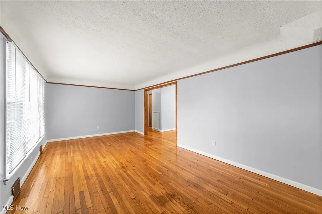 Living Room with Hardwood Floors and Neutrally Painted