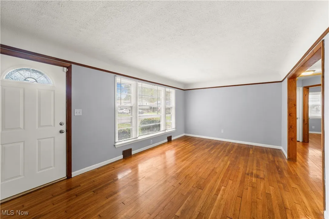 Living Room with Hardwood Floors and Neutrally Painted
