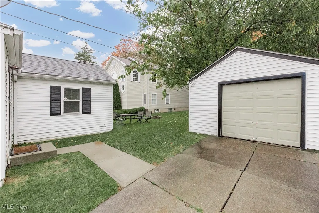 Detached garage featuring driveway