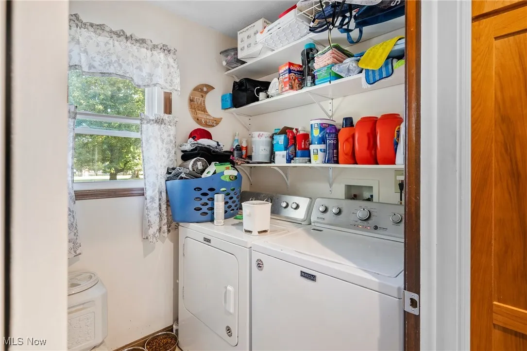 Laundry room featuring washer and clothes dryer