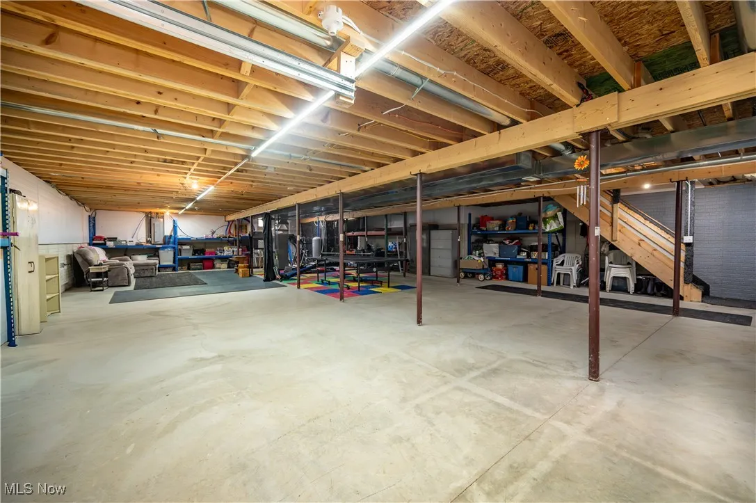 Unfinished basement with stairs