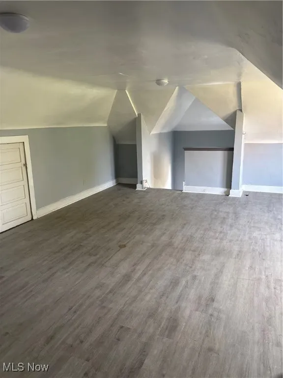 Very spacious master bedroom with vaulted ceiling and vinyl finished floors.