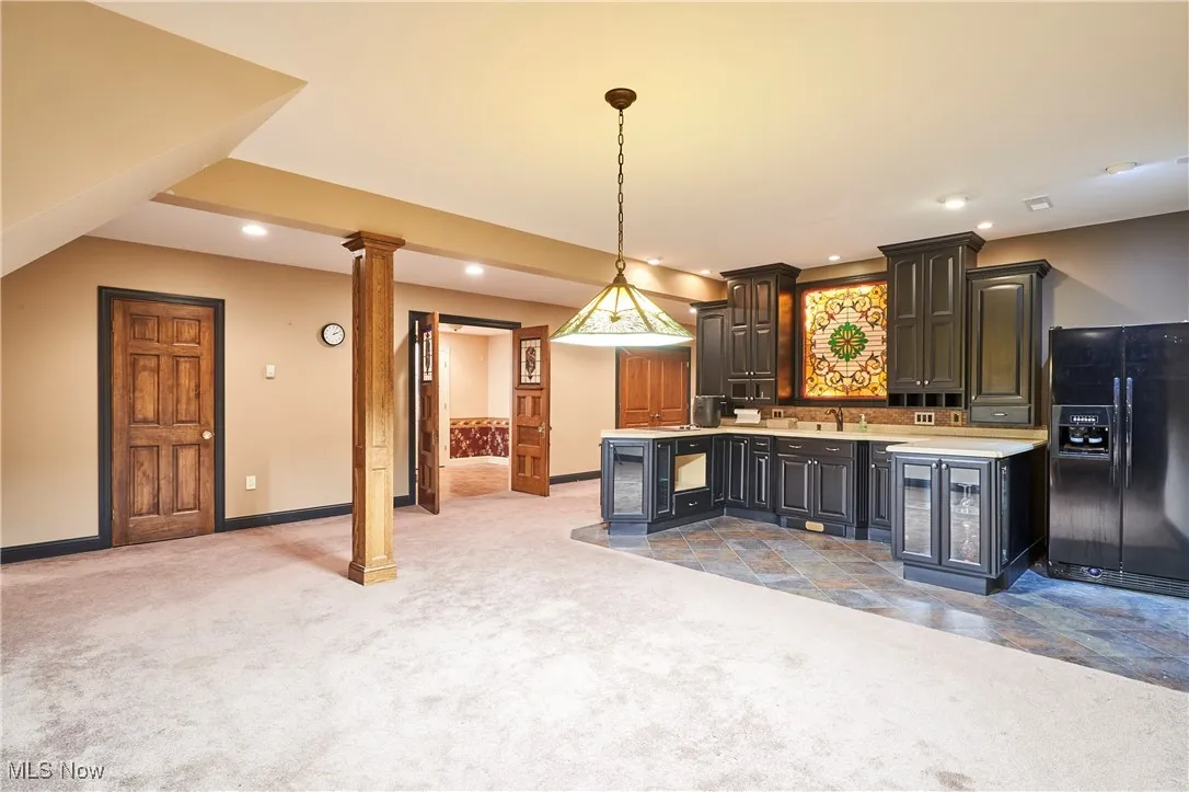 The lower level has 9 ft ceilings and is set up for entertaining with a wet bar with tile floors
