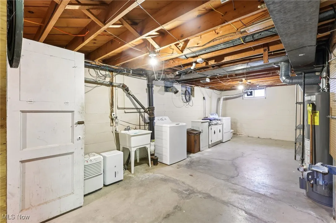 Basement with washer and dryer and water heater