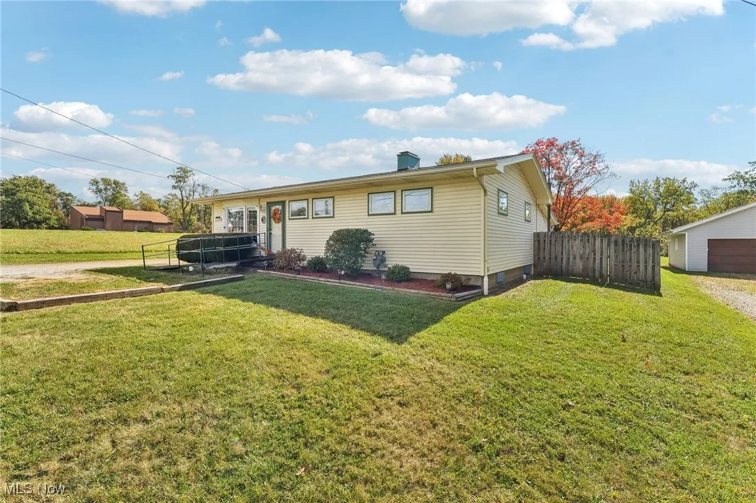 View of front of home featuring a chimney