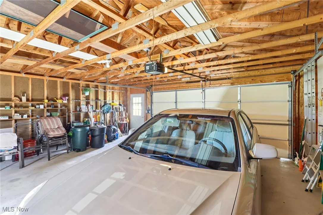 Garage featuring a garage door opener