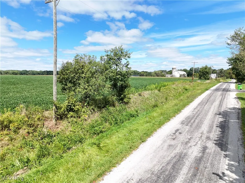 View of asphalt street featuring a view of countryside