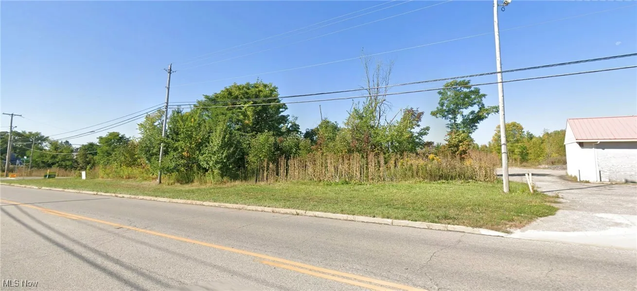 View of asphalt road with curbs