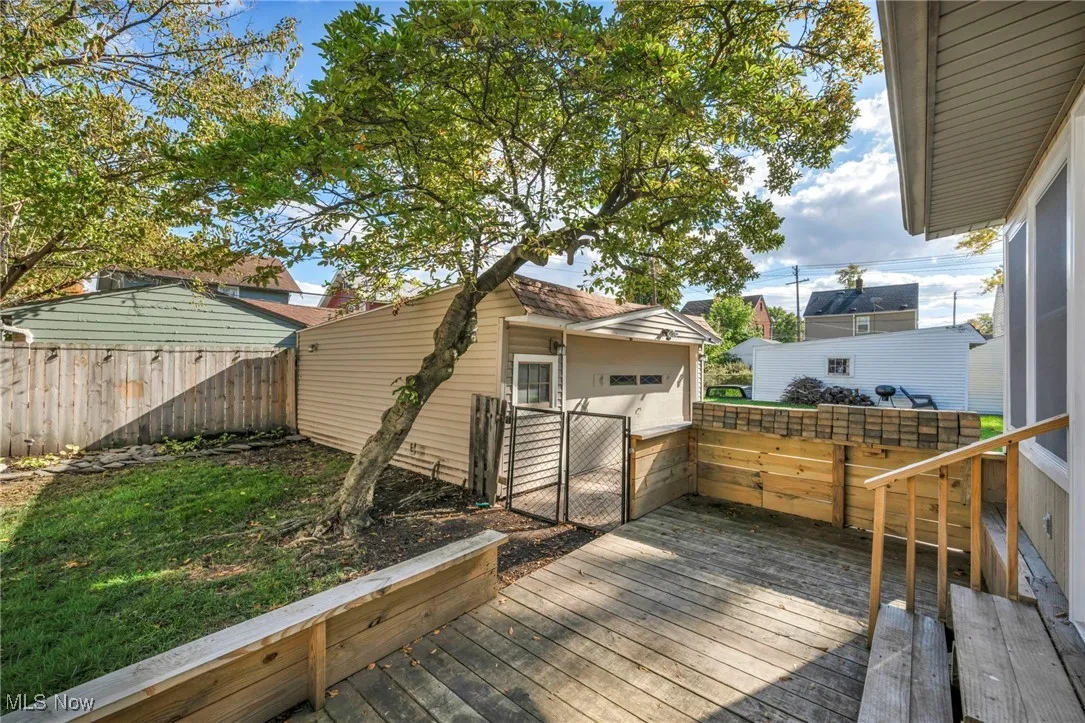 Wooden deck featuring a gate and a fenced backyard