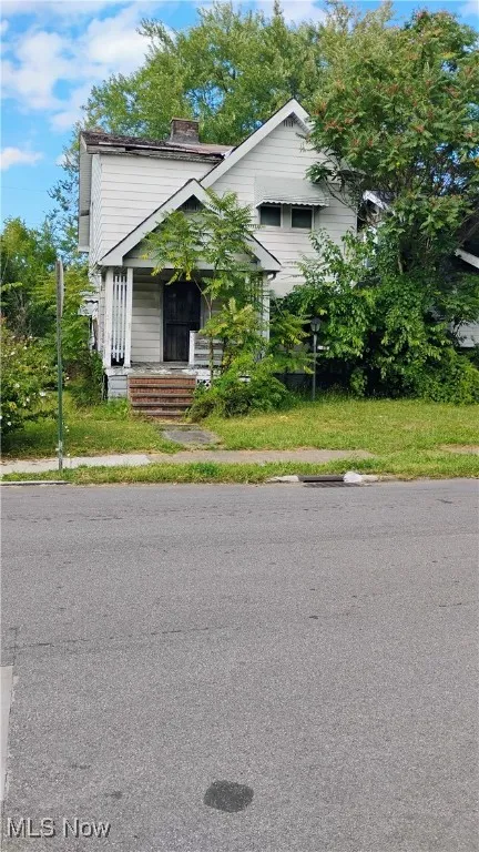 View of front of house featuring a chimney