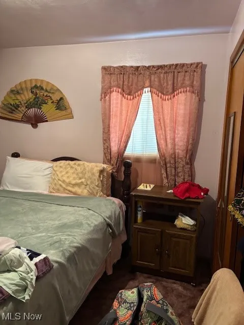 Bedroom 2 featuring dark carpet