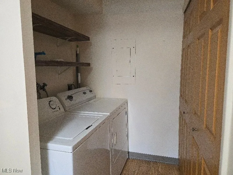 Laundry area with washing machine and clothes dryer
