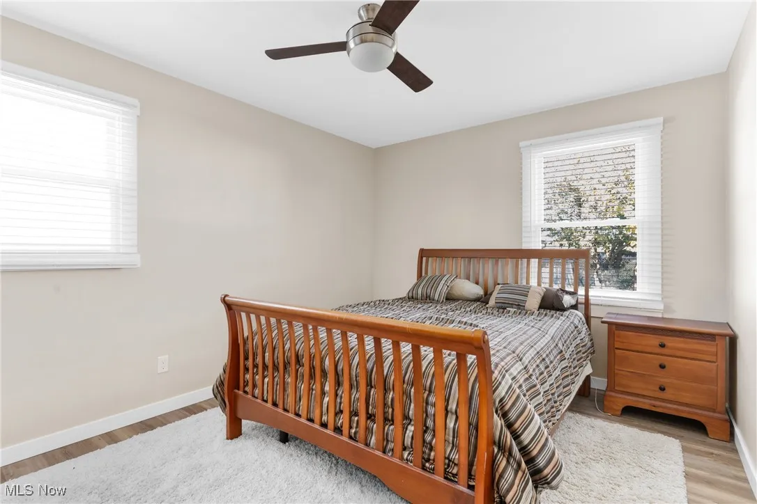 Bedroom featuring light wood-type flooring and a ceiling fan