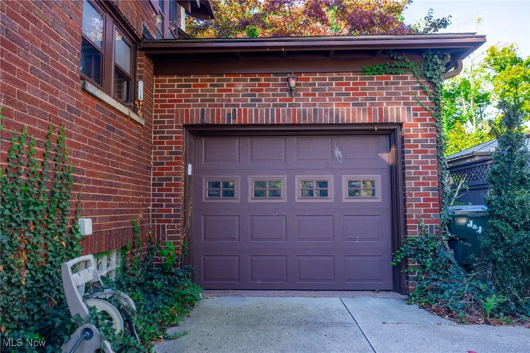 Garage featuring driveway