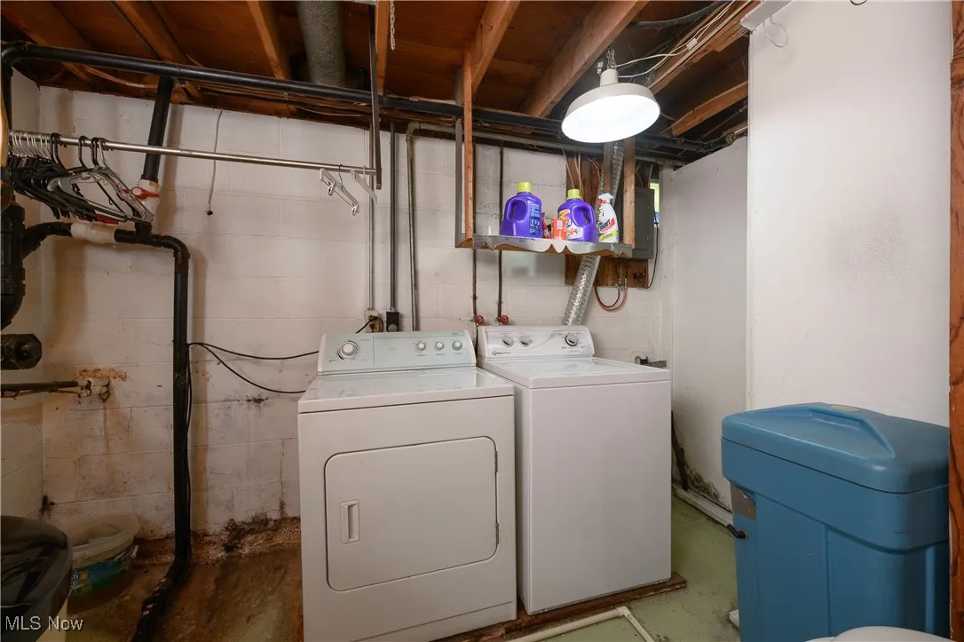 Washroom featuring washer and dryer