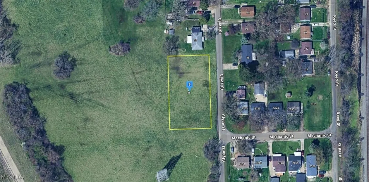 Aerial map of property and surrounding area with property parcel outlined