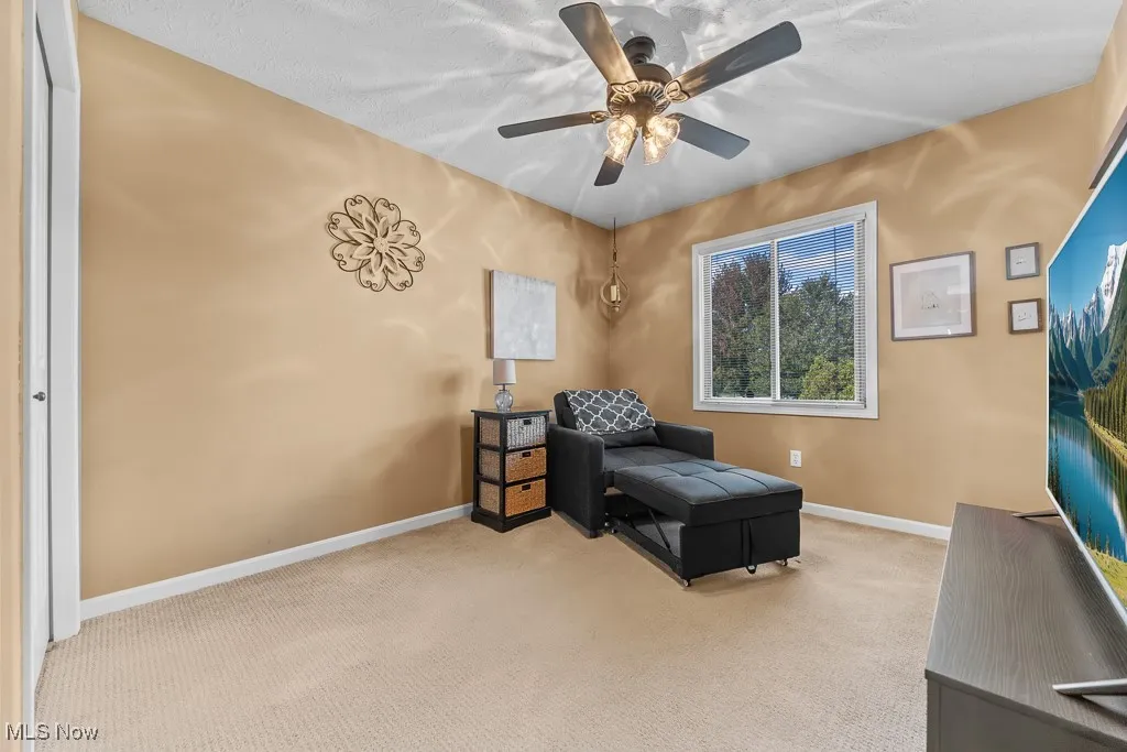 Bedroom featuring carpet floors and a ceiling fan