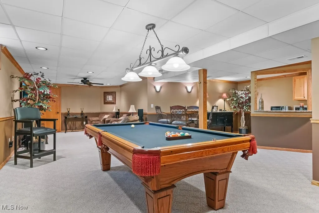 Recreation room with light carpet, a paneled ceiling, ceiling fan, billiards table, and recessed lighting