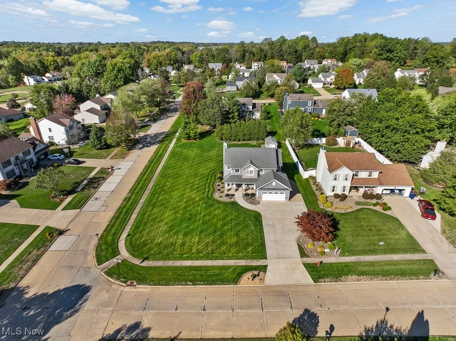 Aerial overview of property's location with nearby suburban area