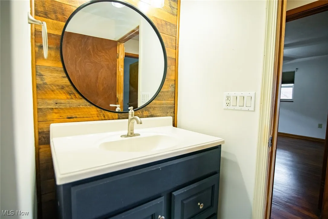 Bathroom with vanity and wood finished floors