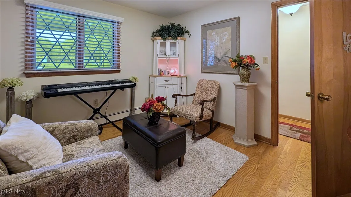 Fourth bedroom or den with hardwood flooring