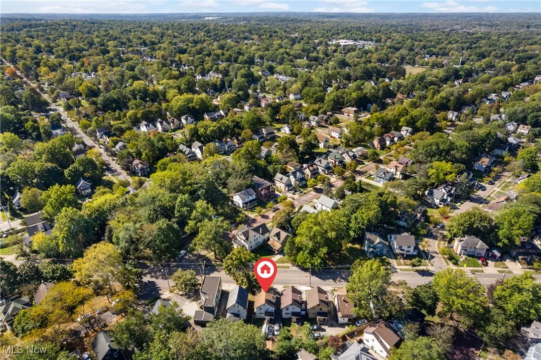 Aerial overview of property's location featuring nearby suburban area