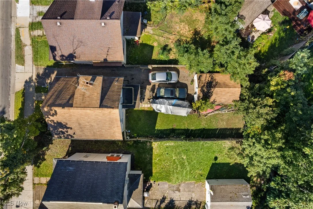 Aerial view of property's location with nearby suburban area