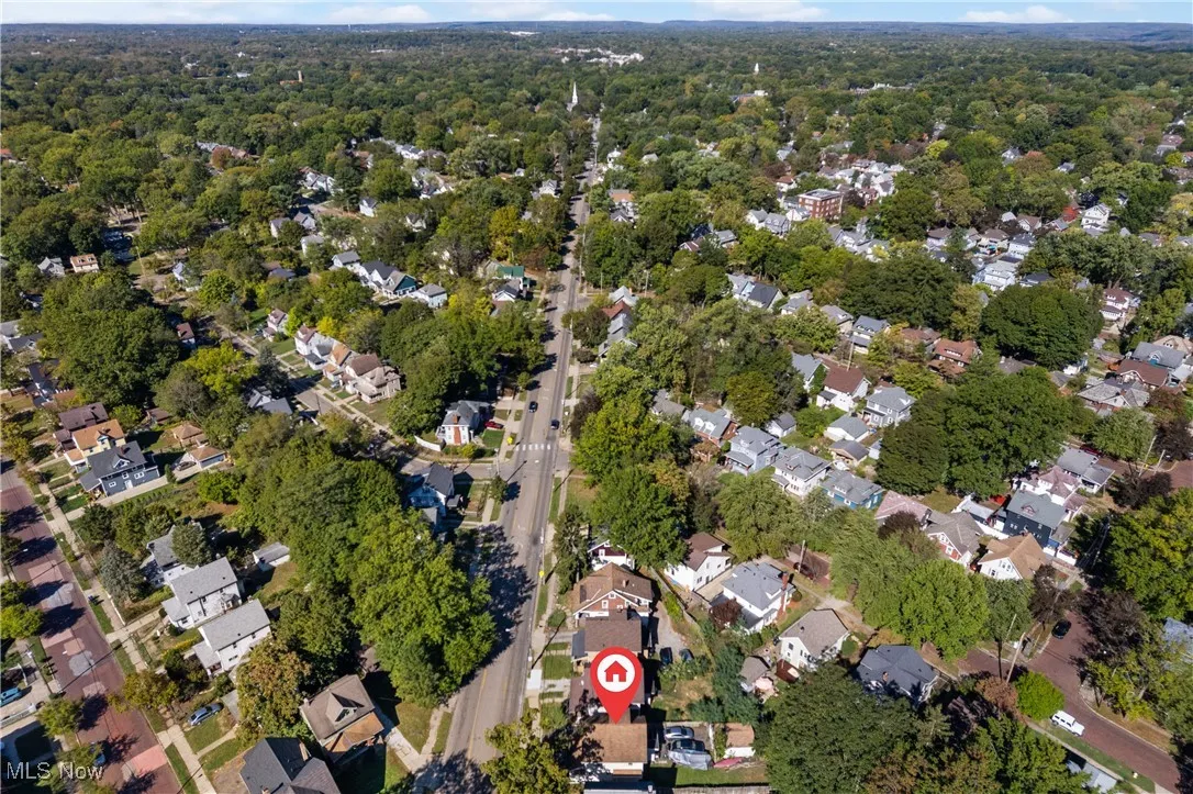 Aerial view of property's location with nearby suburban area