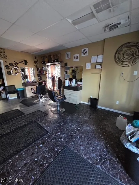 Living room featuring a drop ceiling