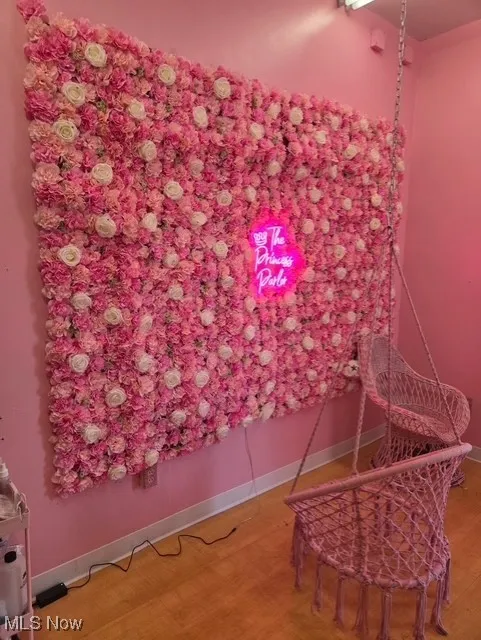 Sitting room featuring wood finished floors
