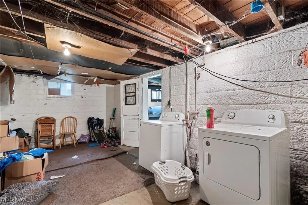 Below grade area with washing machine and dryer
