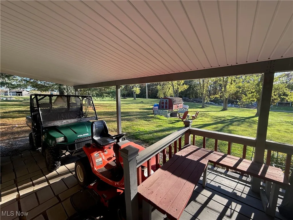 Wooden terrace with a lawn