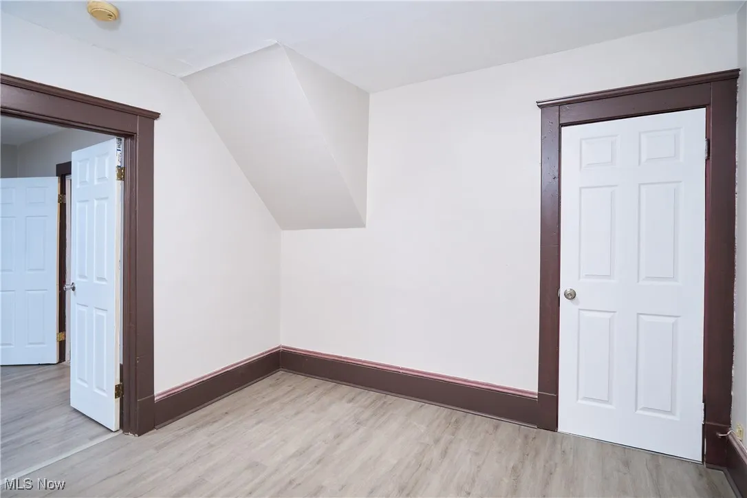 Additional living space with light wood-style flooring