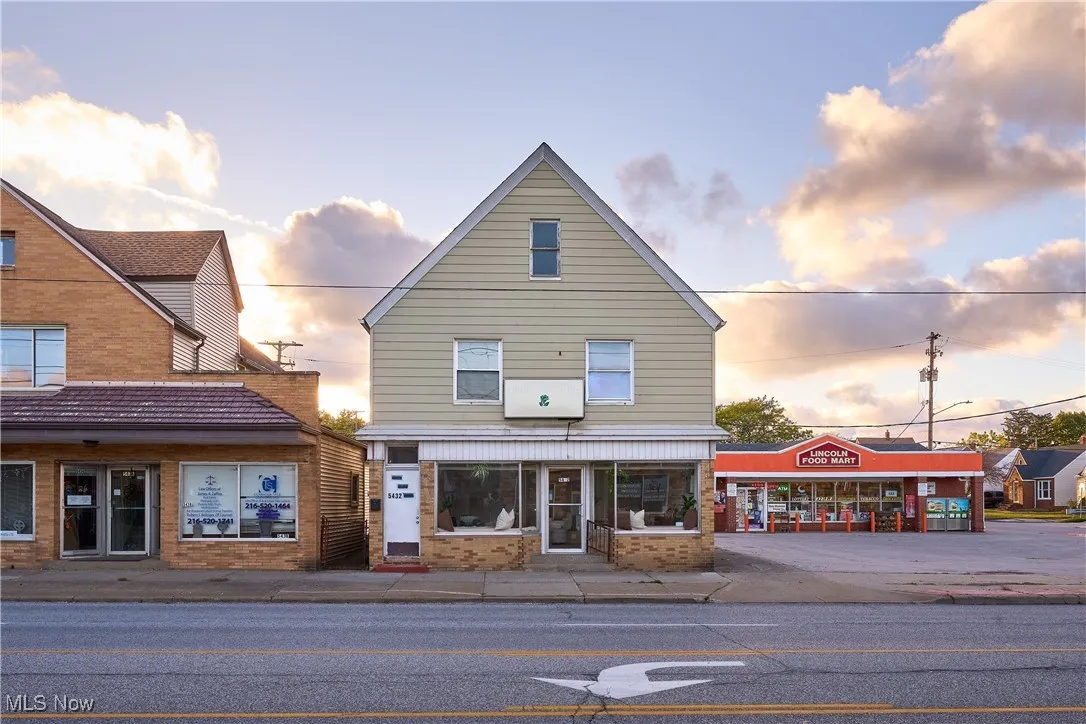 View of property at dusk