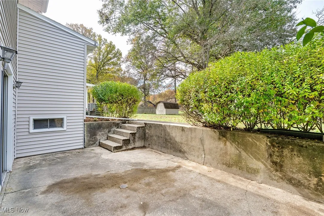 View of patio / terrace with a shed