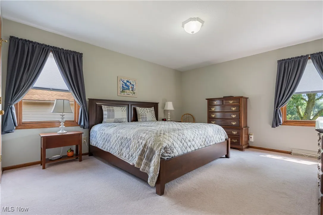 Master bedroom with two windows.