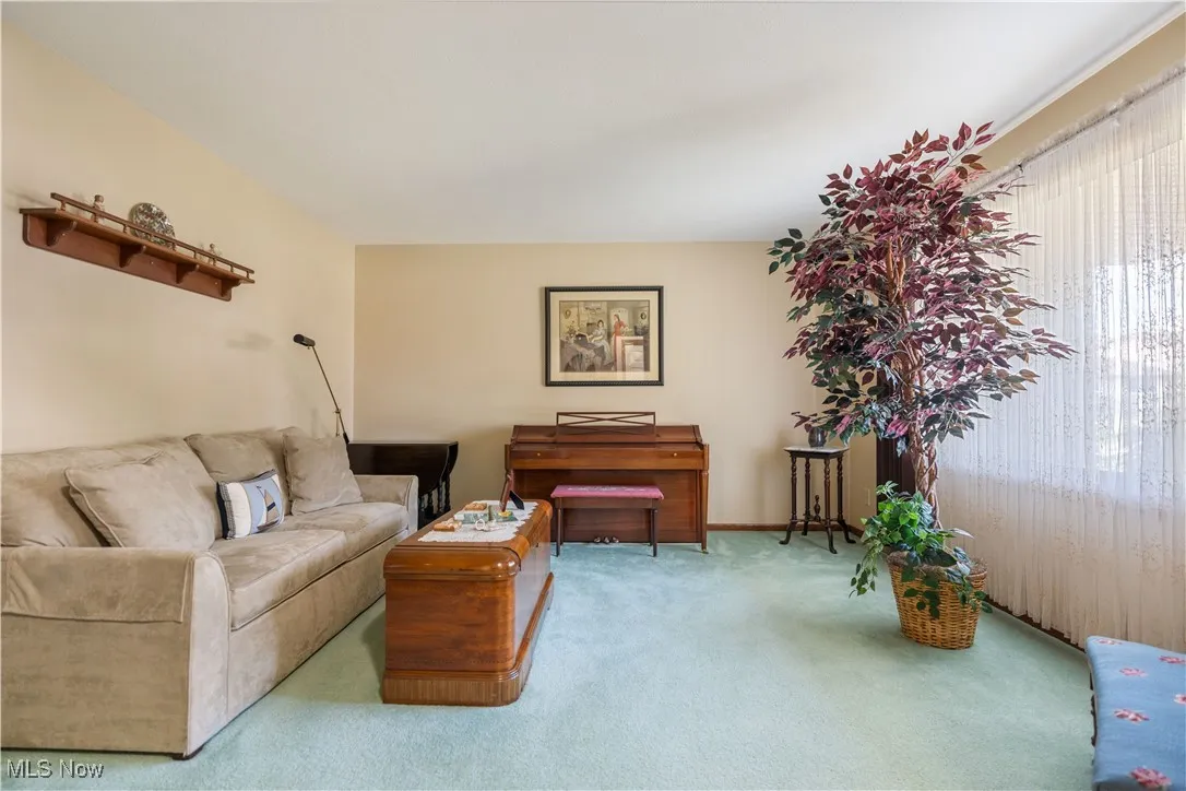 Front facing living room with a large picture window.