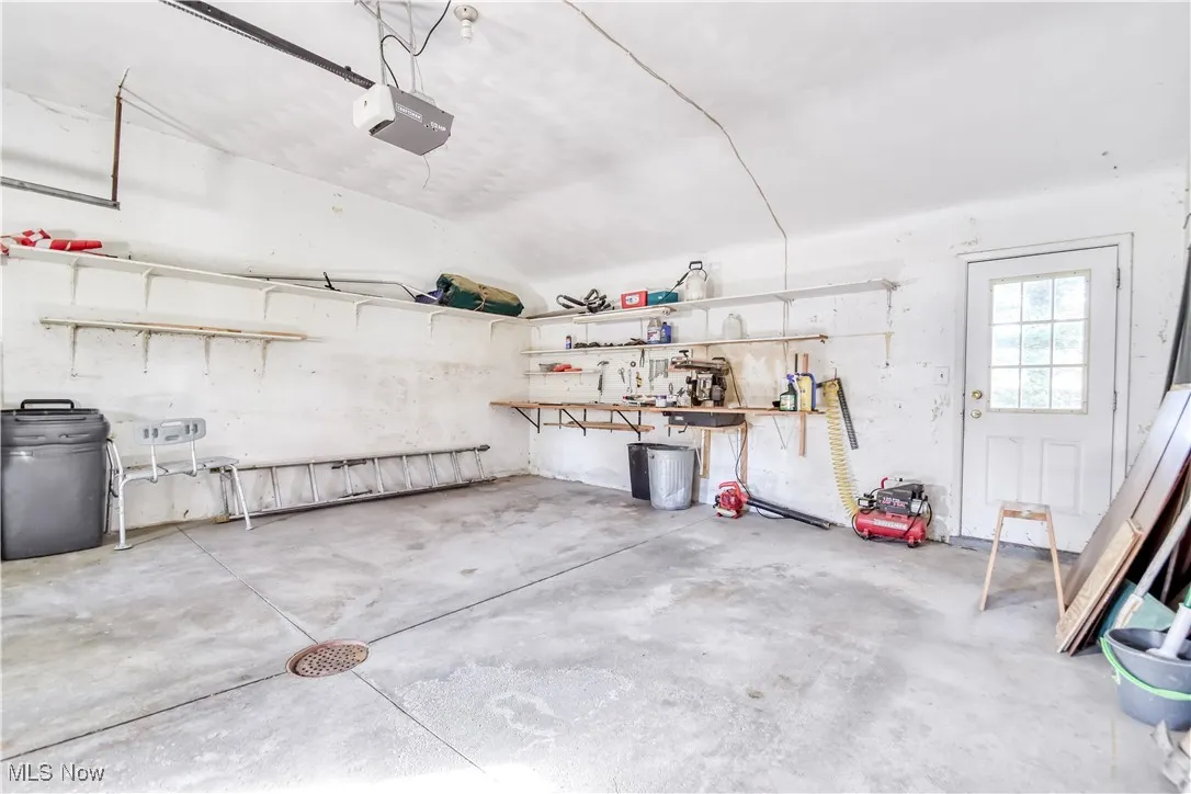 Garage featuring a garage door opener