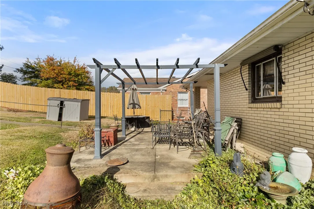 View of patio featuring a pergola and outdoor dining area
