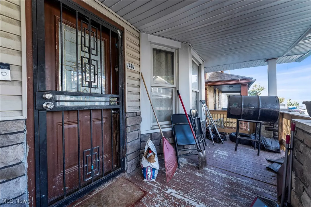 Doorway to property featuring a porch