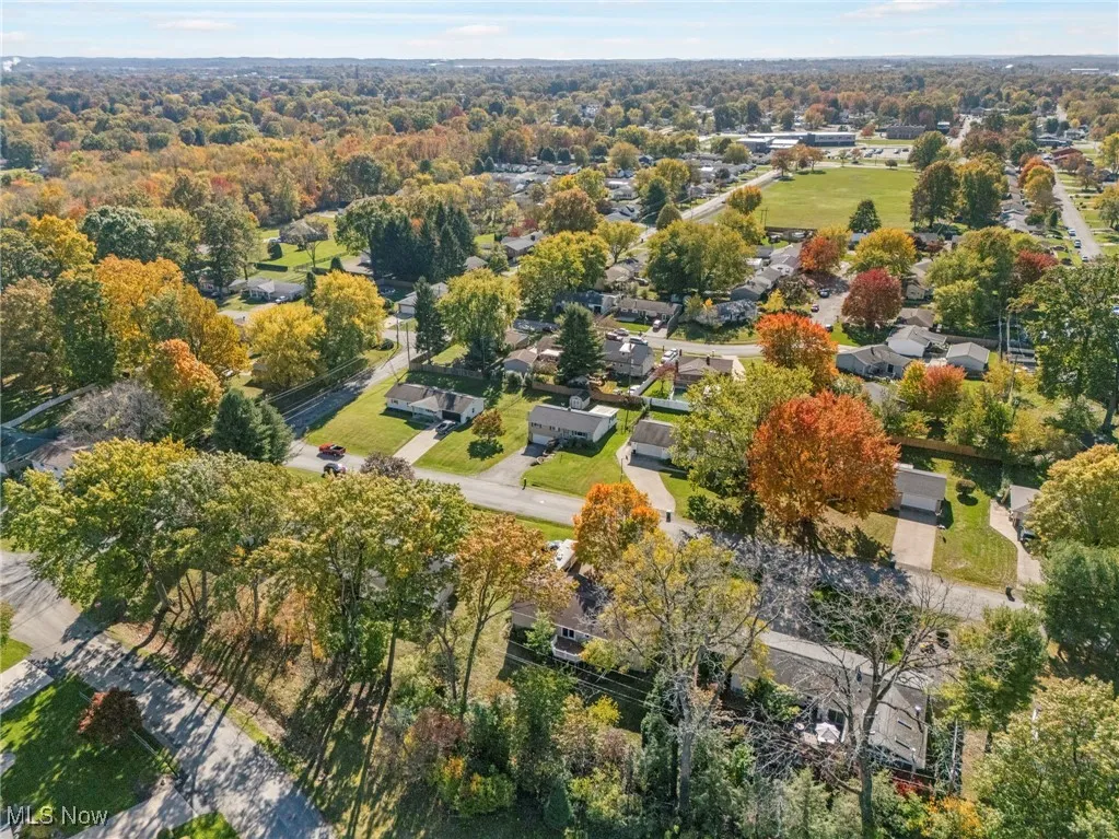 Aerial view of property's location featuring nearby suburban area