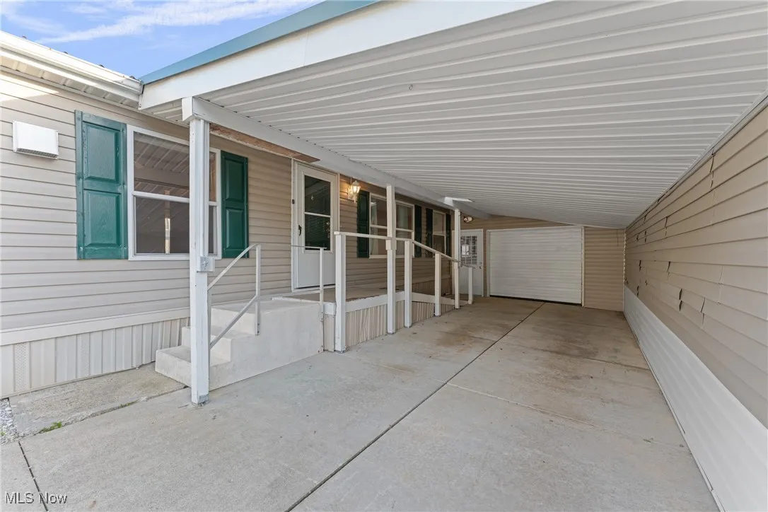 View of patio / terrace featuring an attached carport