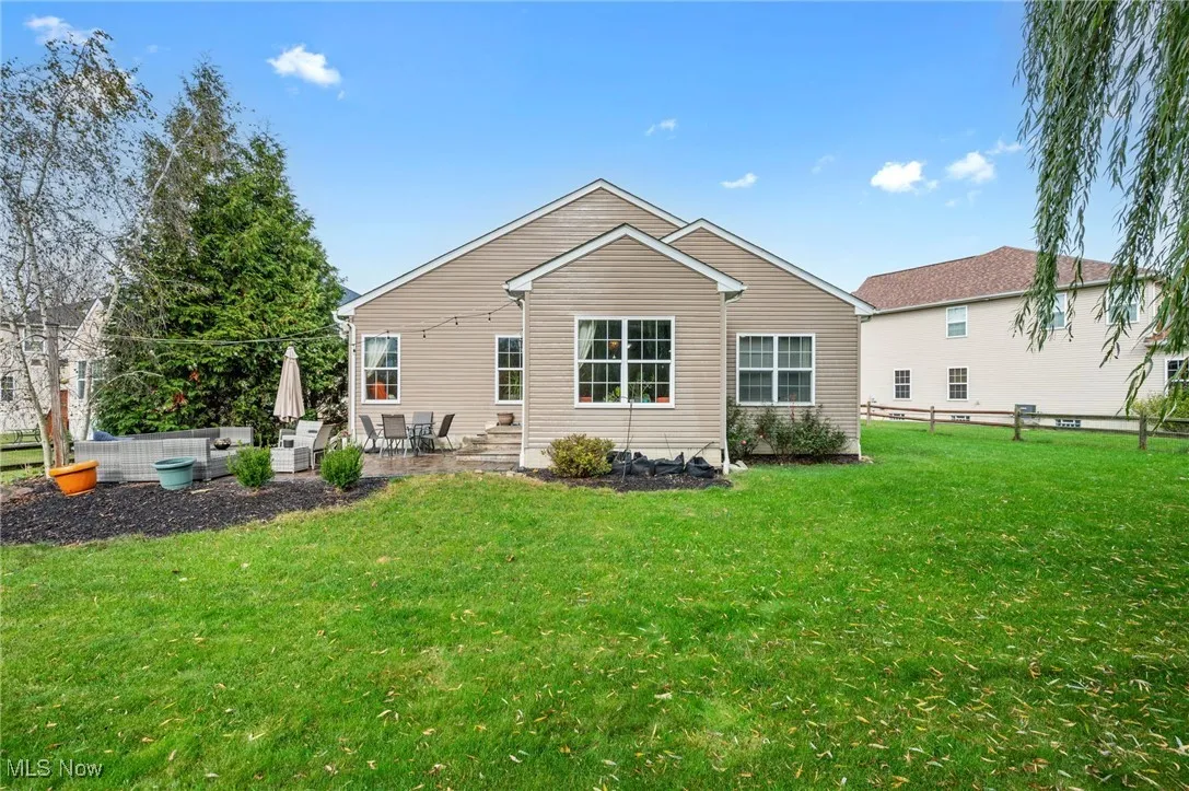 Rear view of house with a patio