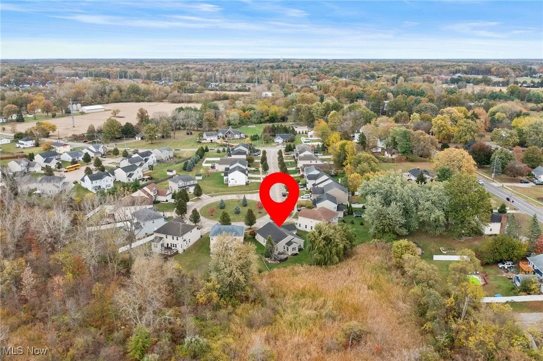 Aerial overview of property's location featuring nearby suburban area