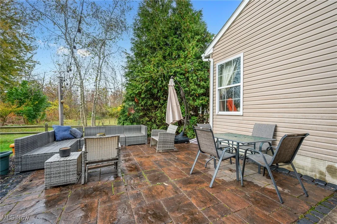 View of patio featuring an outdoor living space and outdoor dining​​‌​​​​‌​​‌‌​‌‌​​​‌‌​‌​‌​‌​​​‌​​ space